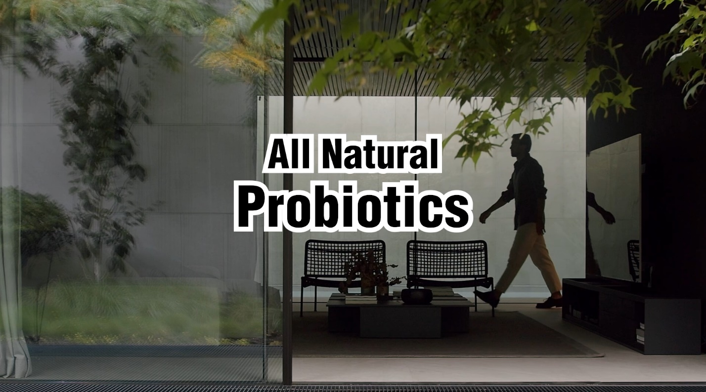 A person walking in front of a glass wall